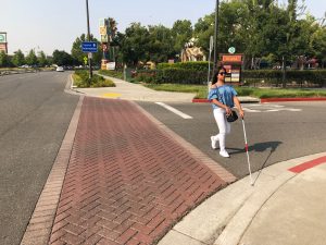 Blind person while crossing the street approaching the curve