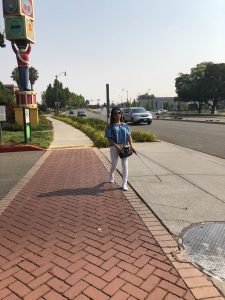 Blind person crossing the street while so many vehicles nearby