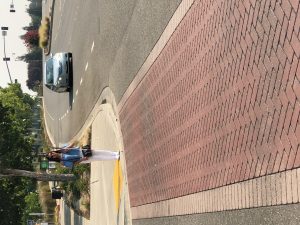 blind in mobility training waiting at curve to cross the street